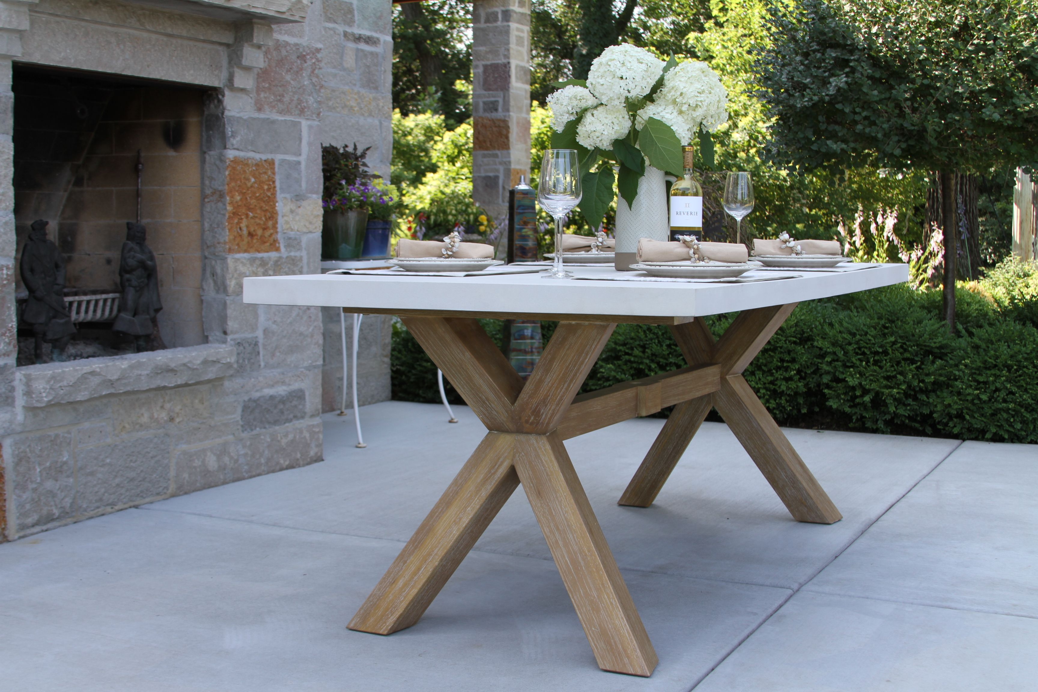 Outdoor Interiors Ivory Composite and Eucalyptus Dining Table